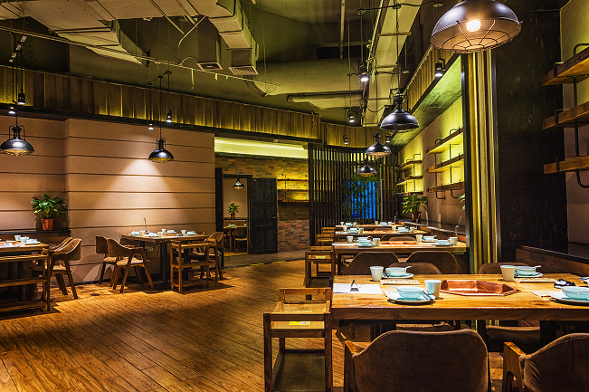 Warm, dimly lit interior of the Cibo gustoso restaurant