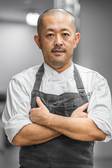 Portrait of head chef Bryan Machado with arms crossed